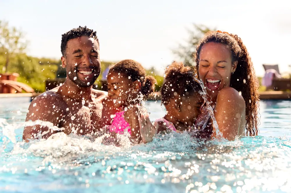 Black family splashin in the pool